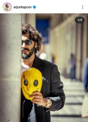 Arjun Kapoor Posing with a Smiley Mask in Paris