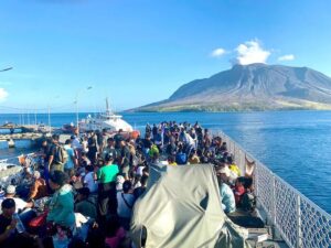 Residents of Tagulandang Island being evacuated by a navy ship after Mount Ruang volcano erupted in Sitaro, North Sulawes. 