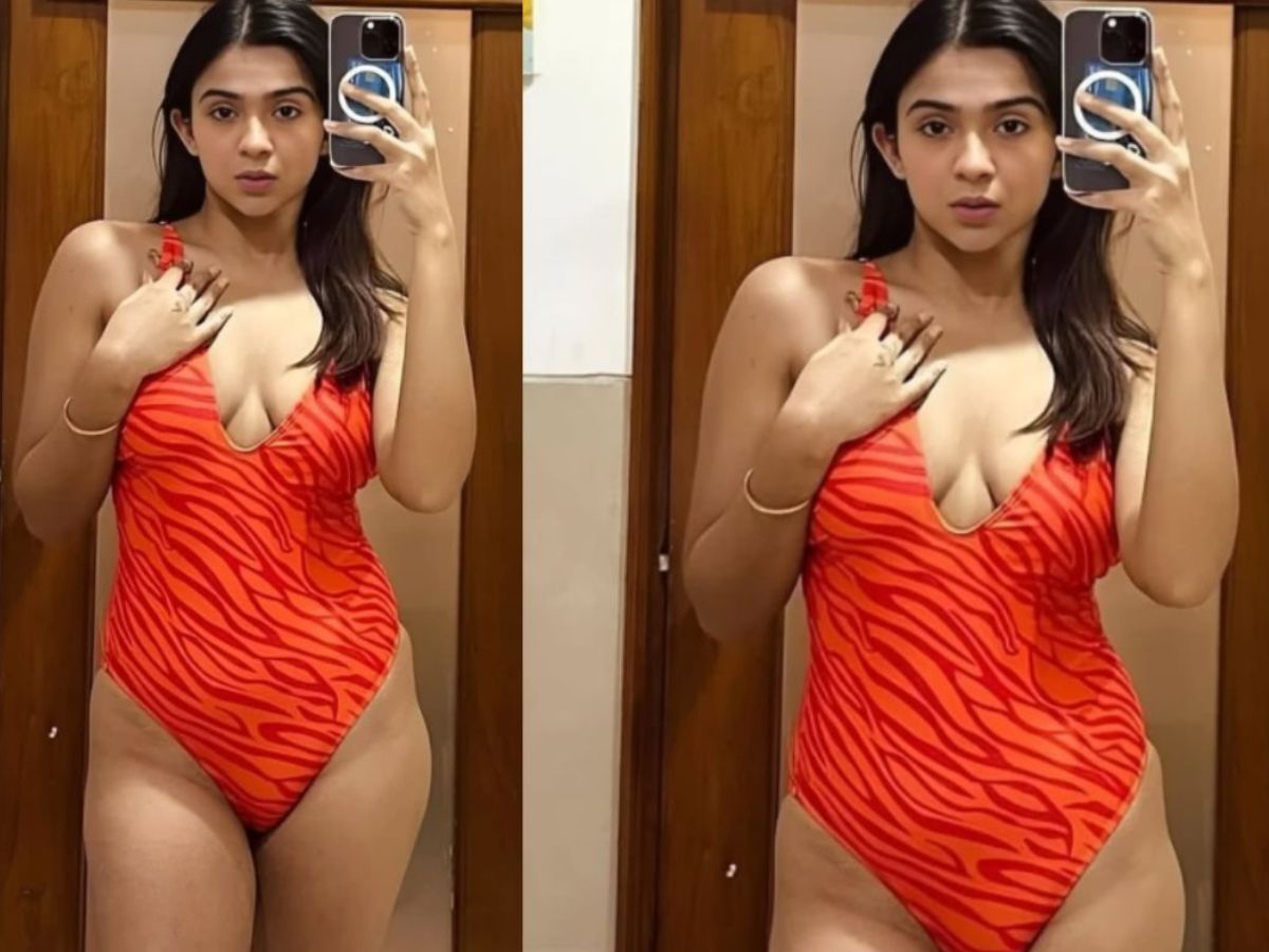Apoorvas cleavage show in red orange bikini - Photo Gallery