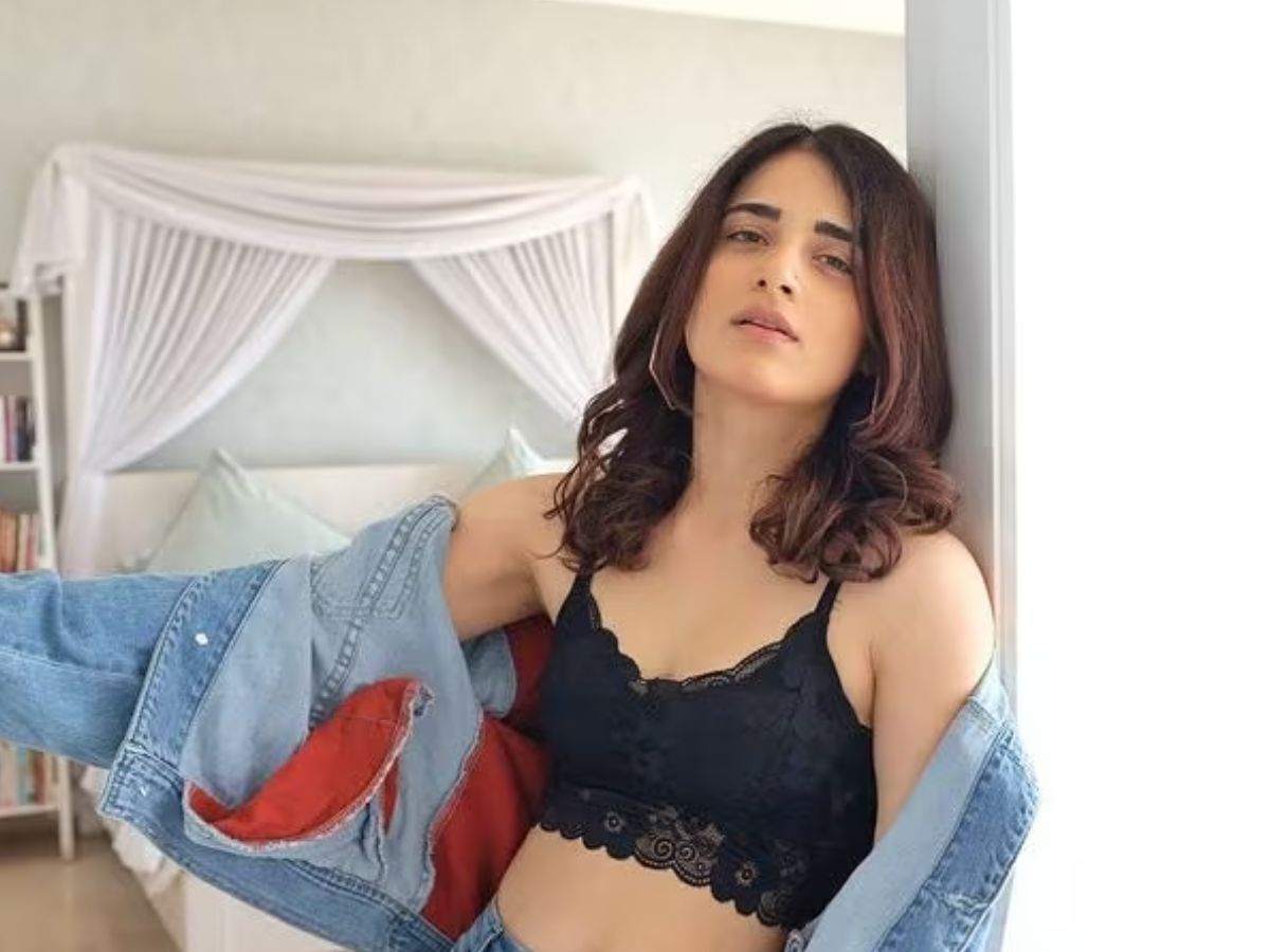 Radhika Madan sizzling glam in black bralette and oversized denim - Photo Gallery