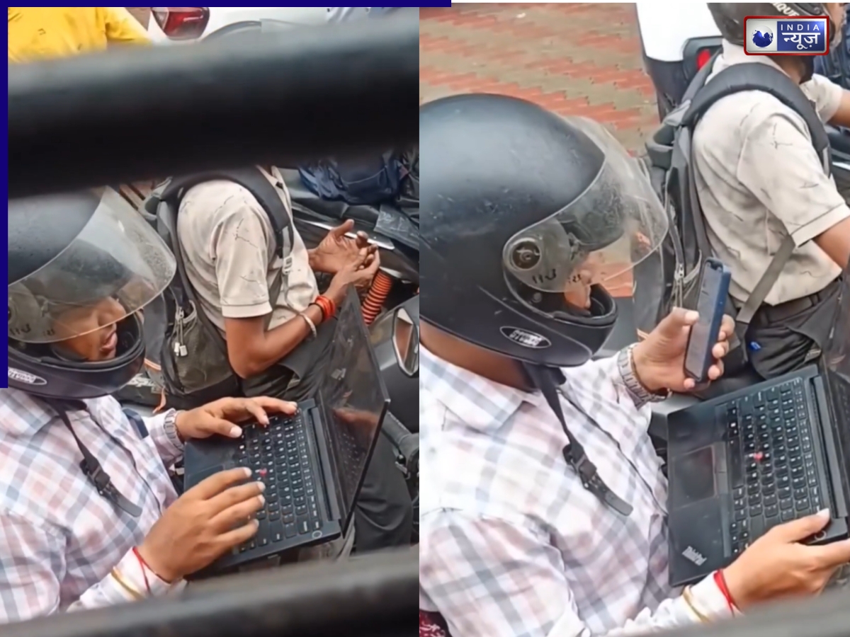 ऑफिस का इतना प्रेशर? ट्रैफिक जाम में बाइक पर बैठकर लैपटॉप चलाने लगा युवक