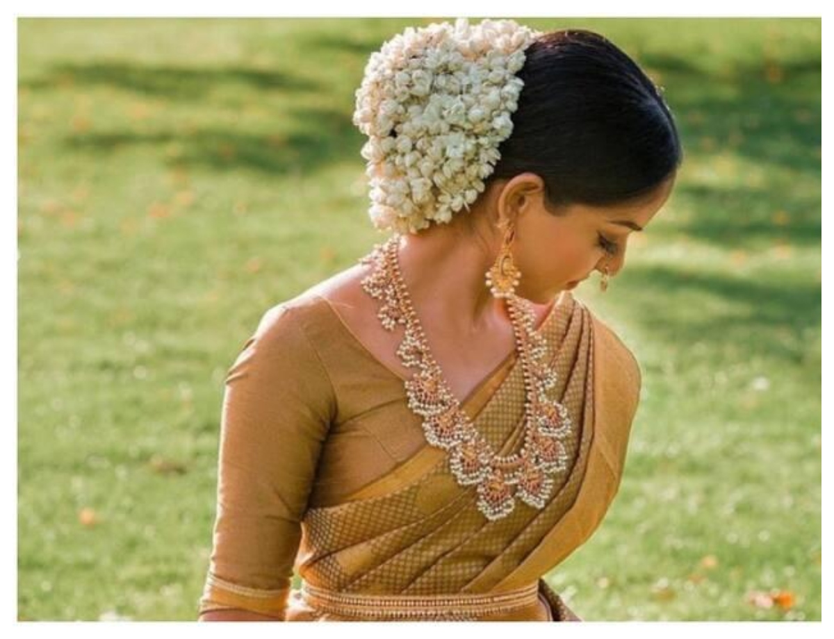 Decorate the bun with gajra all around - Photo Gallery
