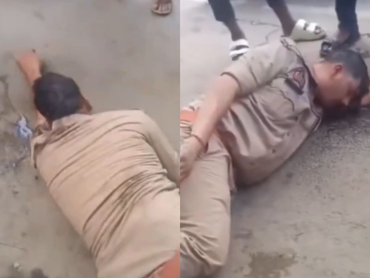 Jaunpur Viral Video: नशे में सड़क किनारे पड़ा मिला सिपाही, खुद को बताया ‘DM का बेटा’; VIDEO वायरल